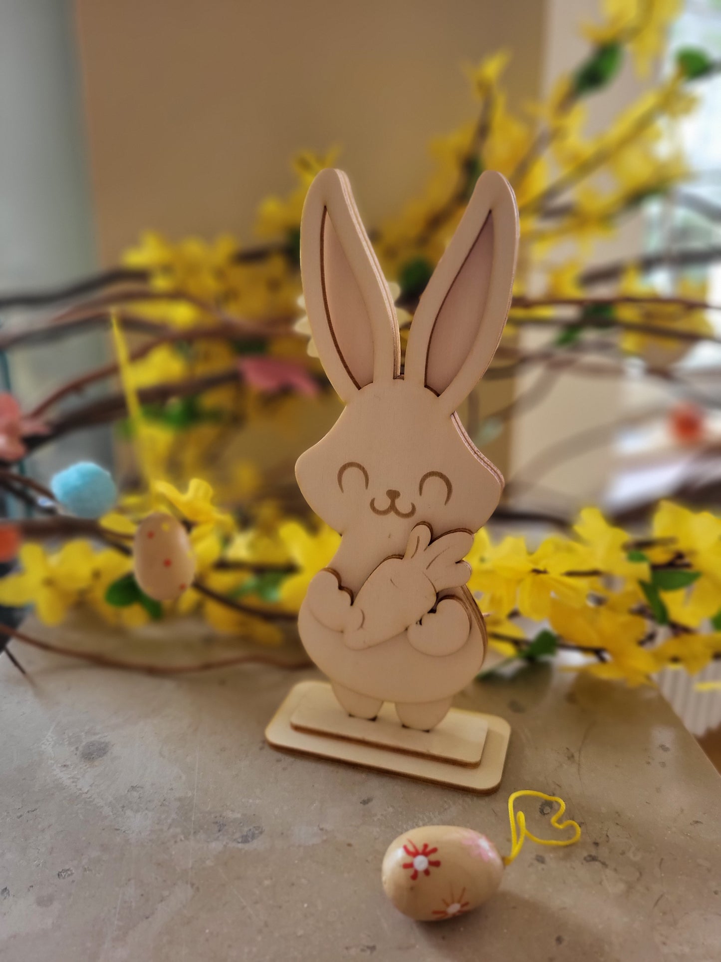 Petit lapin sur son support en trois couches